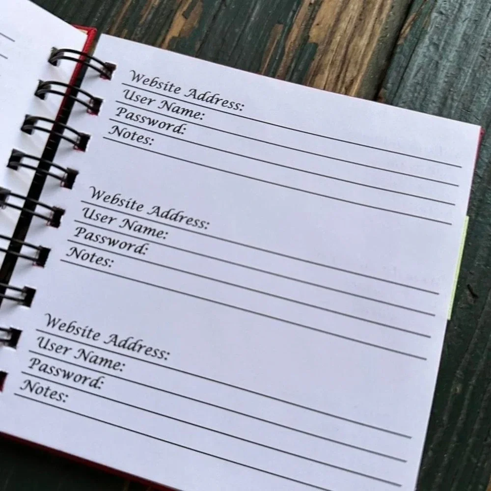 Red and yellow spiral website address book with ribbon